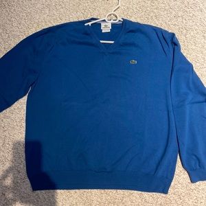Mens long sleeve Lacoste Sweater. Size 7. Brighter blue . Perfect condition.